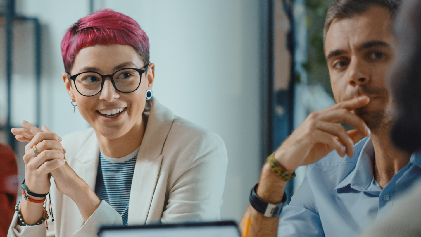 a woman and a man at a meeting